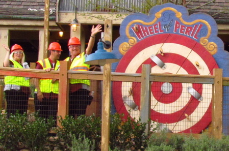 Two Imagineers waving at Storybook Circus under construction - 2012