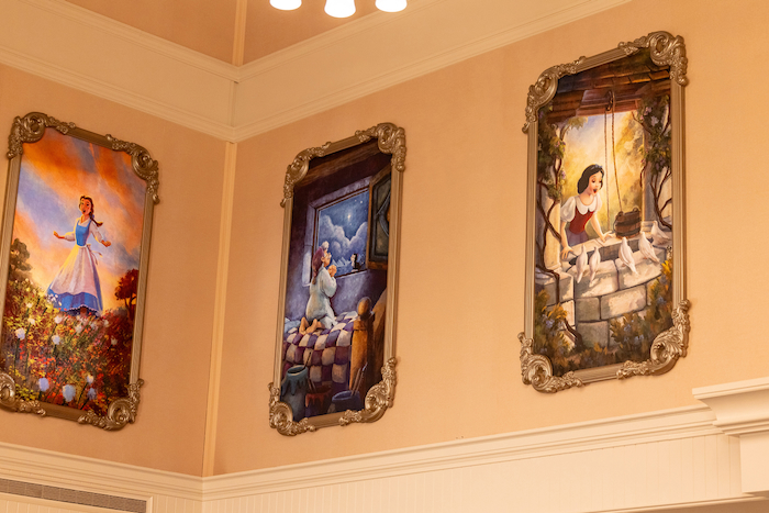 Portraits on the wall of 1900 Park Fare at Disney's Grand Floridian Resort
