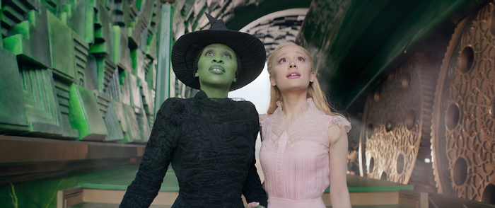 L to R: Cynthia Erivo is Elphaba and Ariana Granda is Glinda in WICKED, directed by Jon M. Chu